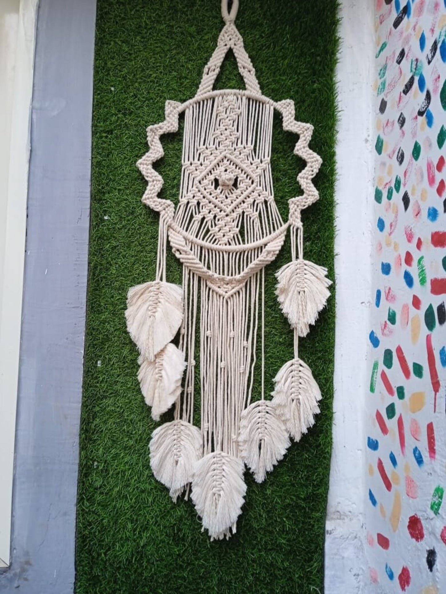 Handcrafted Macramé Evil Eye Wall Hanging with Feather Tassels